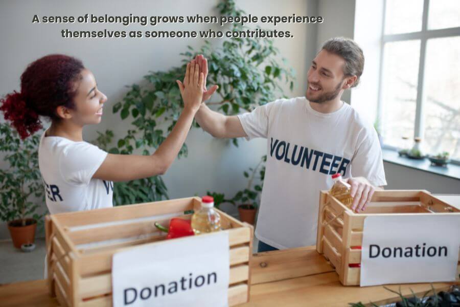two people contributing to the community to build belonging